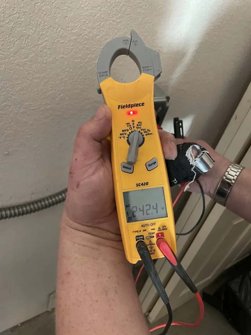 Voltage testing with clamp meter during Hot Tub / Pool Electrical Wiring in Larned